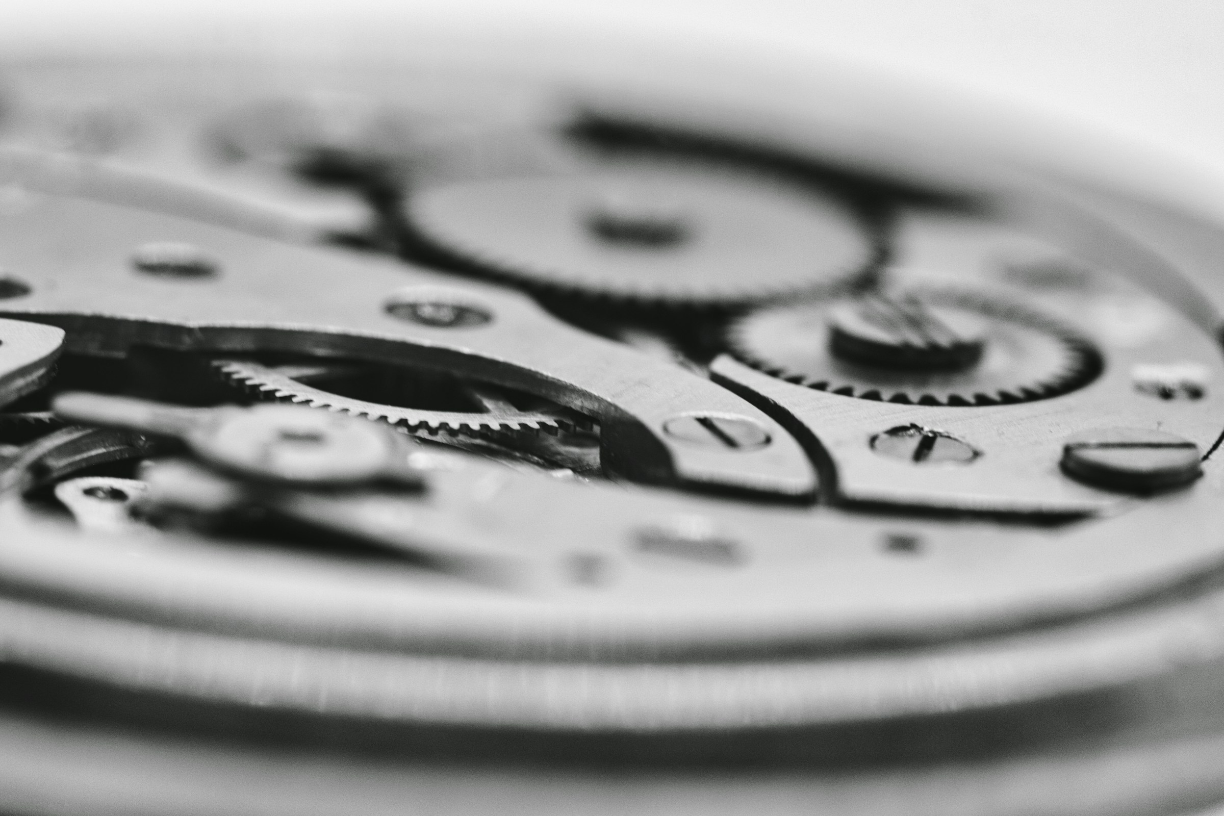 Interconnected precision components in a mechanical watch
