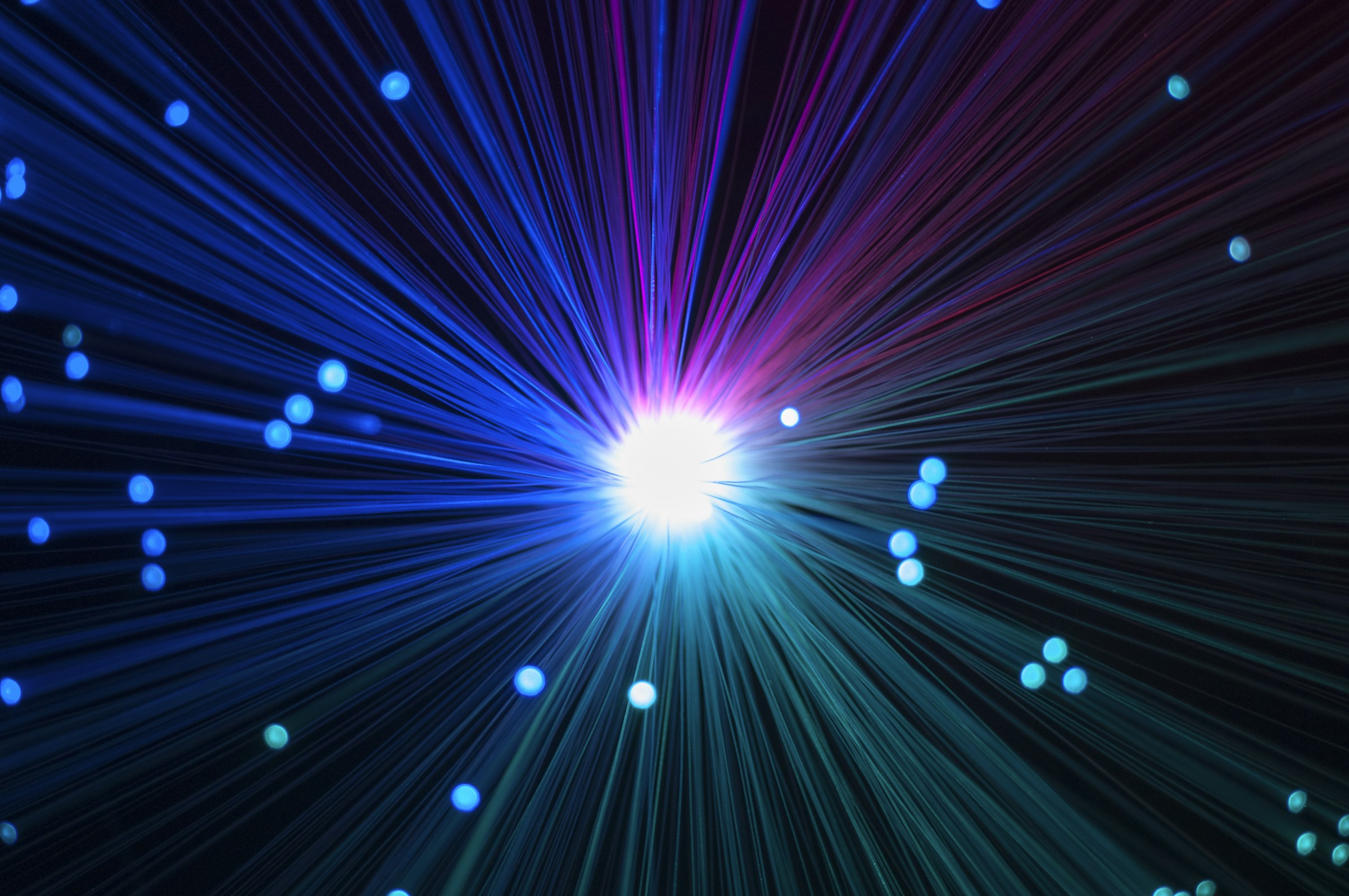 Light converging through optical fibres, illustrating aligned information